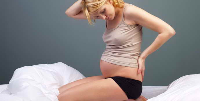Беременность при грыже поясничного отдела позвоночника: как справиться с проблемой
